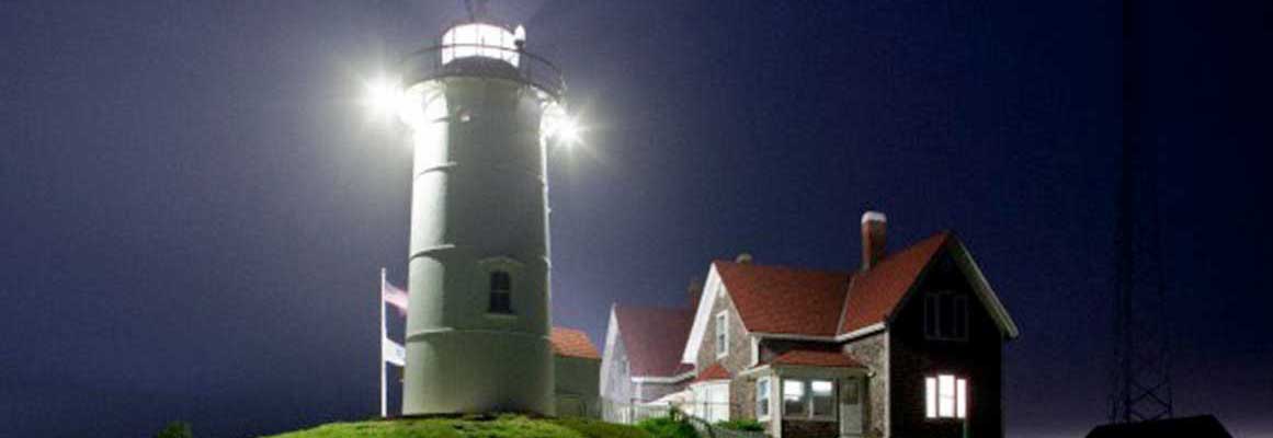 The lighthouse at night will feel secure with an automated system from Cape Cod Alarm.